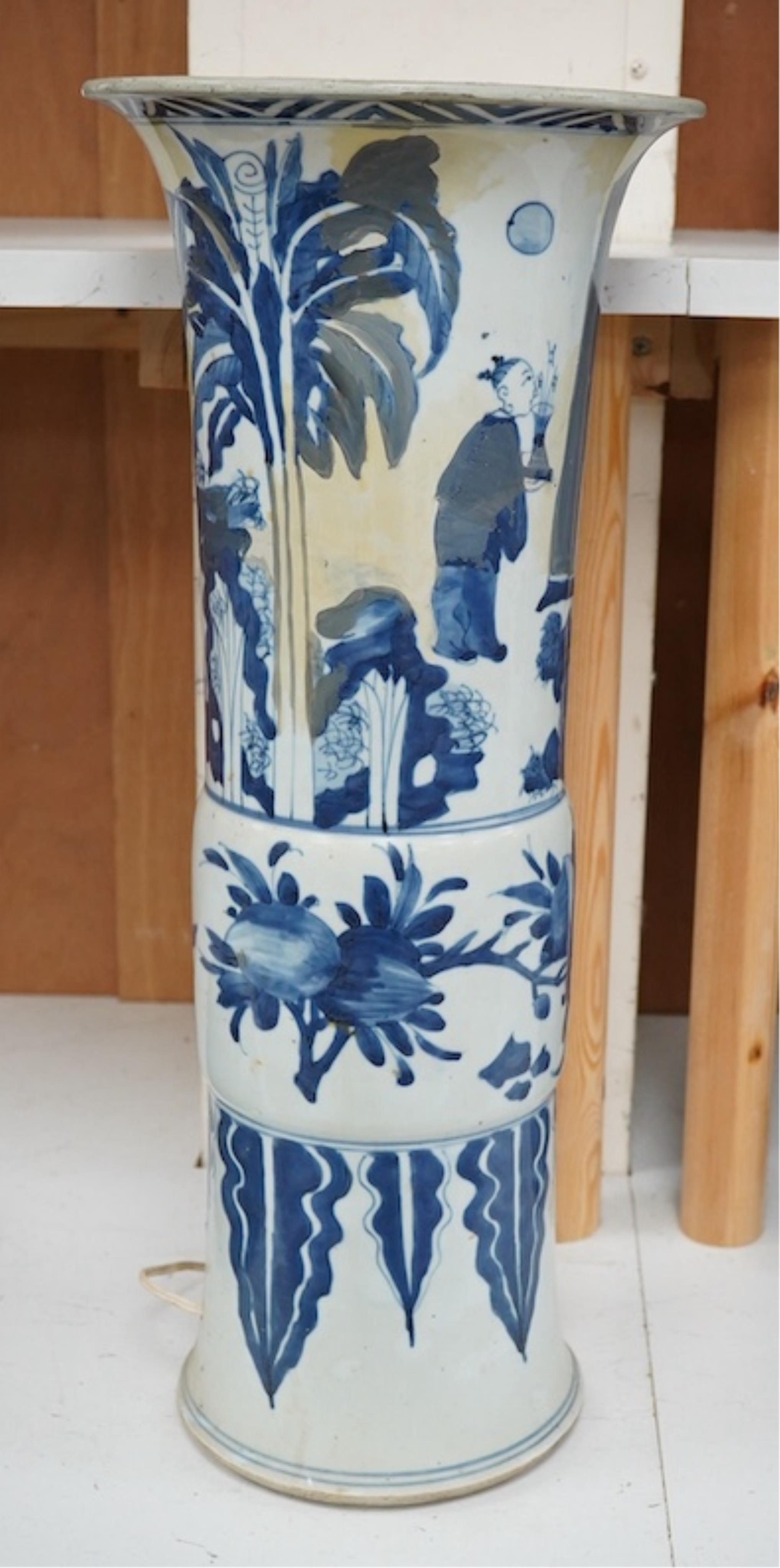 A Chinese blue and white sleeve vase. 53cm high. Condition - heavily restored.